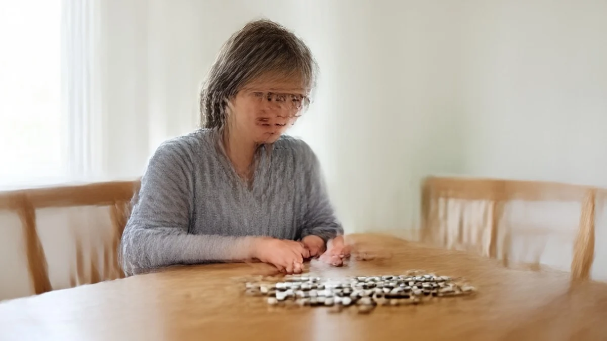 A middle-aged divorced woman thoughtfully compares two distinct arrangements of neutral colored tokens on a dining table